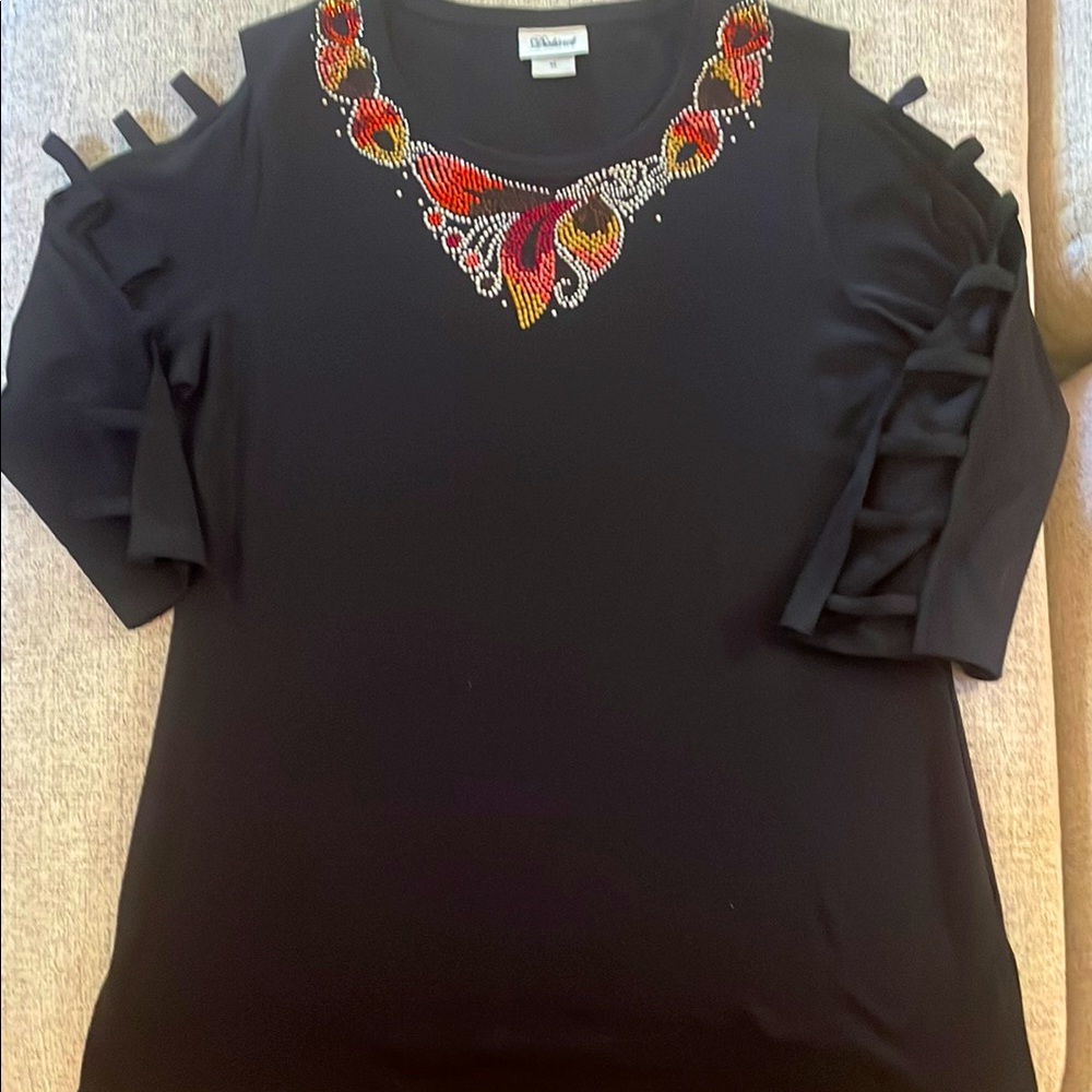 Black top with unique rhinestone embellishments